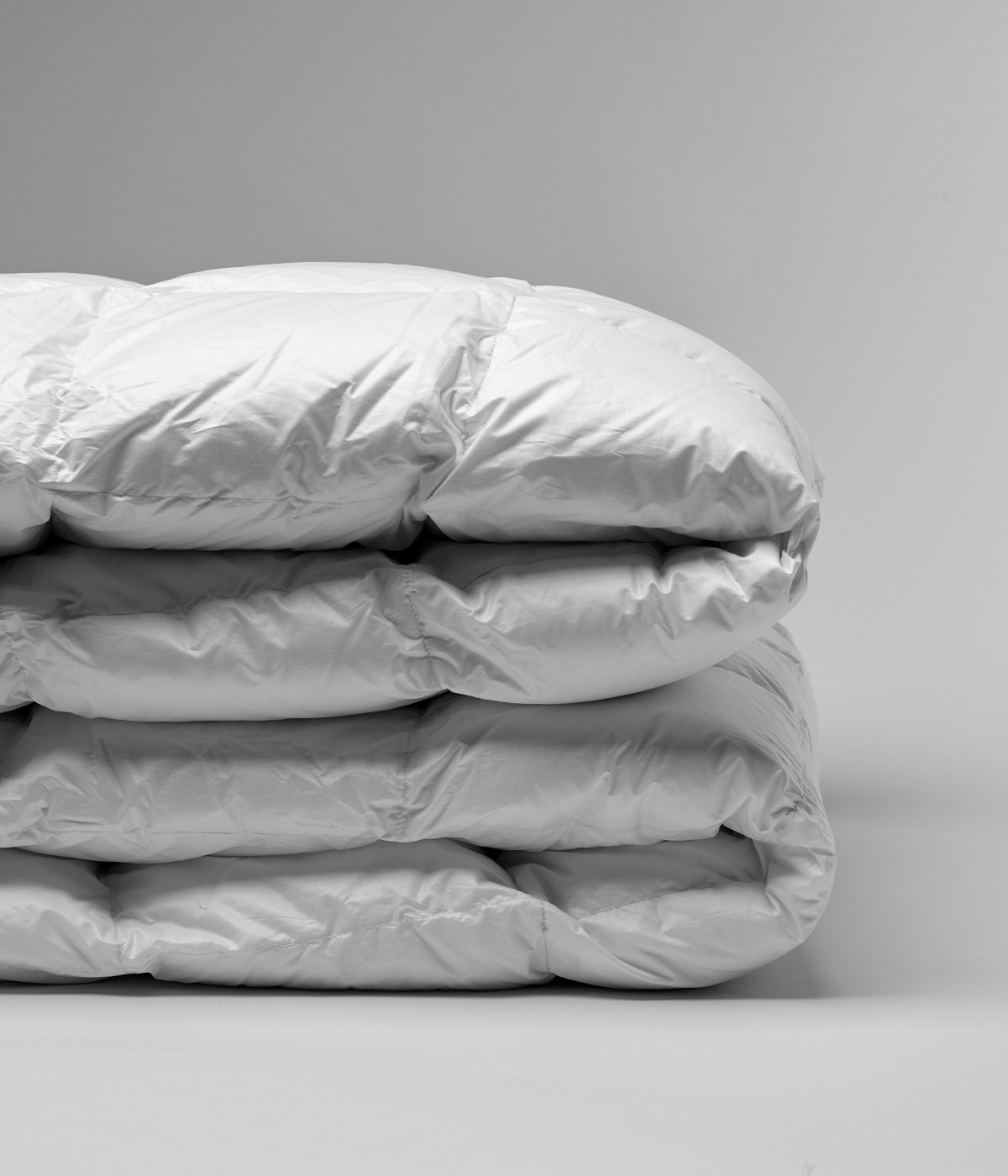 Down Comforters folded and stacked